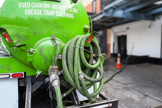 a grease trap pumping truck at a restaurant in Hawthorne